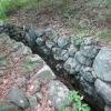 The stone-lined walls of an old mill race channel along the Marsh Loop Trail- Photo by Daniel Chazin