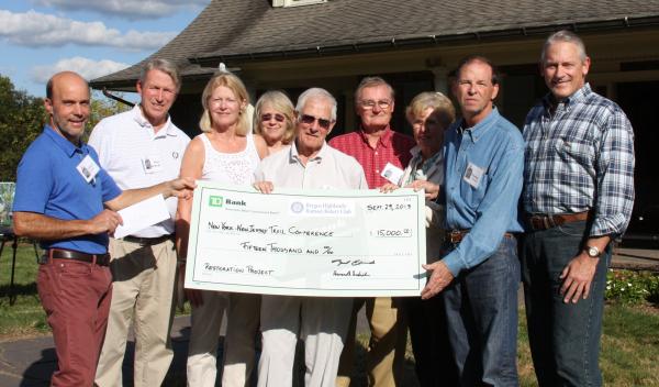 Ed Goodell, Executive Director, Peter and Pam McBride, Pam Goldman, Bryant Malcolm, hosts Dick and Carol Greene, Bergen Rotary President Tom Grissom and Mike DiLella 