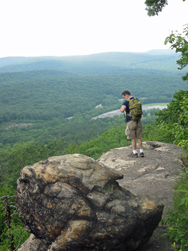 Hiker looking west from the AT-TT on West Mountain. Photo by Daniel Chazin