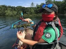 AISF Crew Member Kate does an aquatic plant rake survey. Photo by Erin Carrus